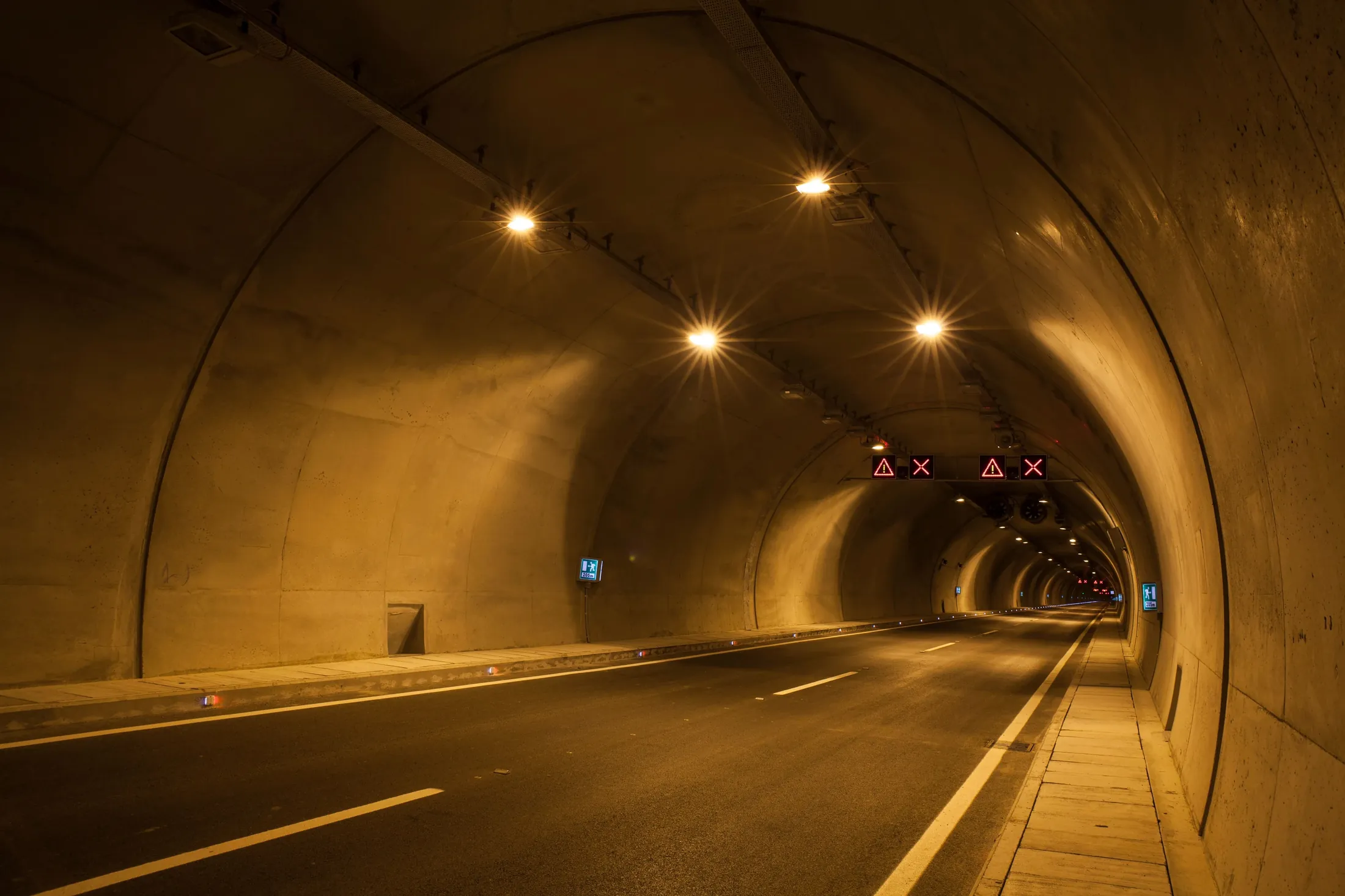 An illuminated road tunnel, used as a representative image