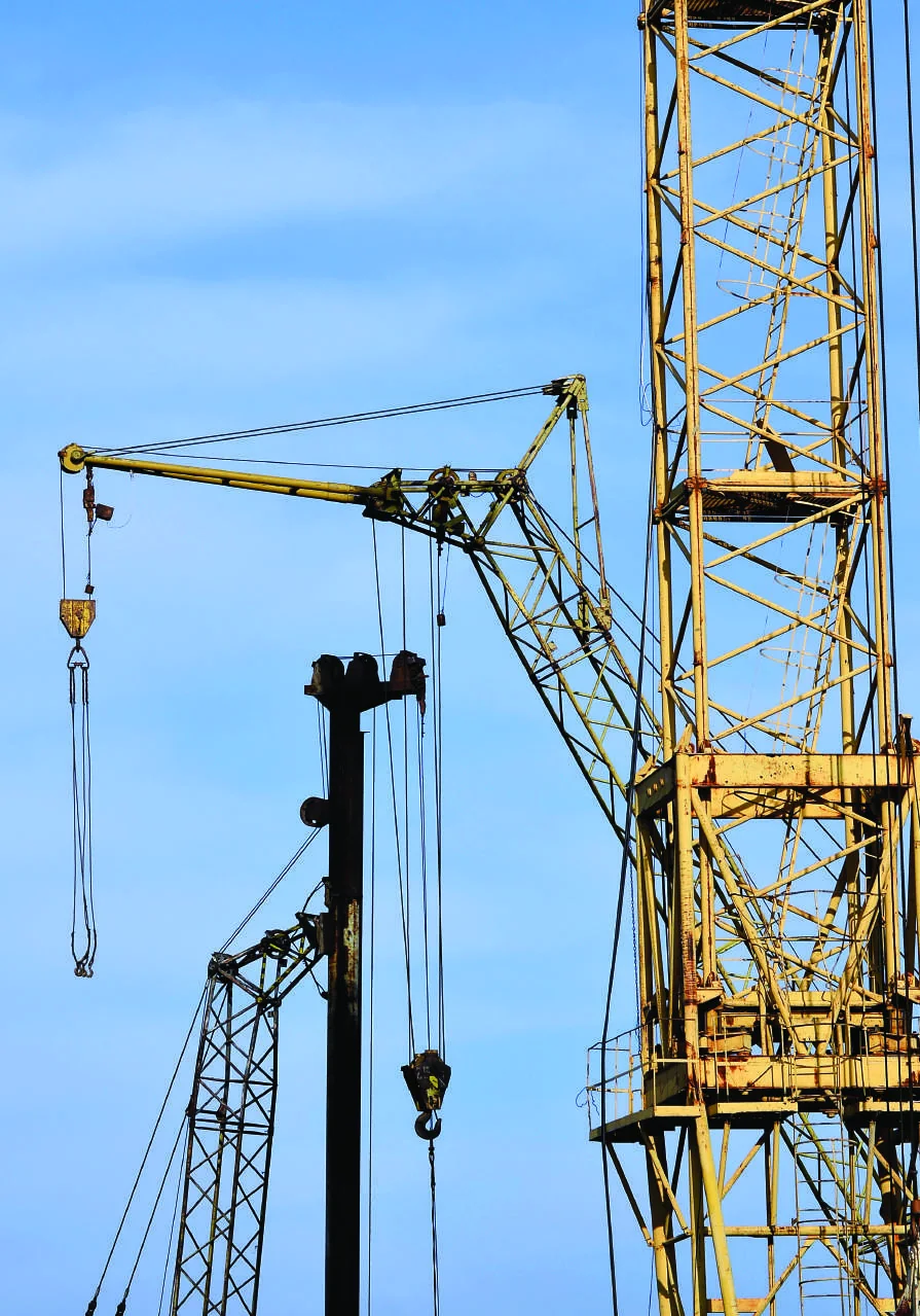 Tower crane against a blue sky